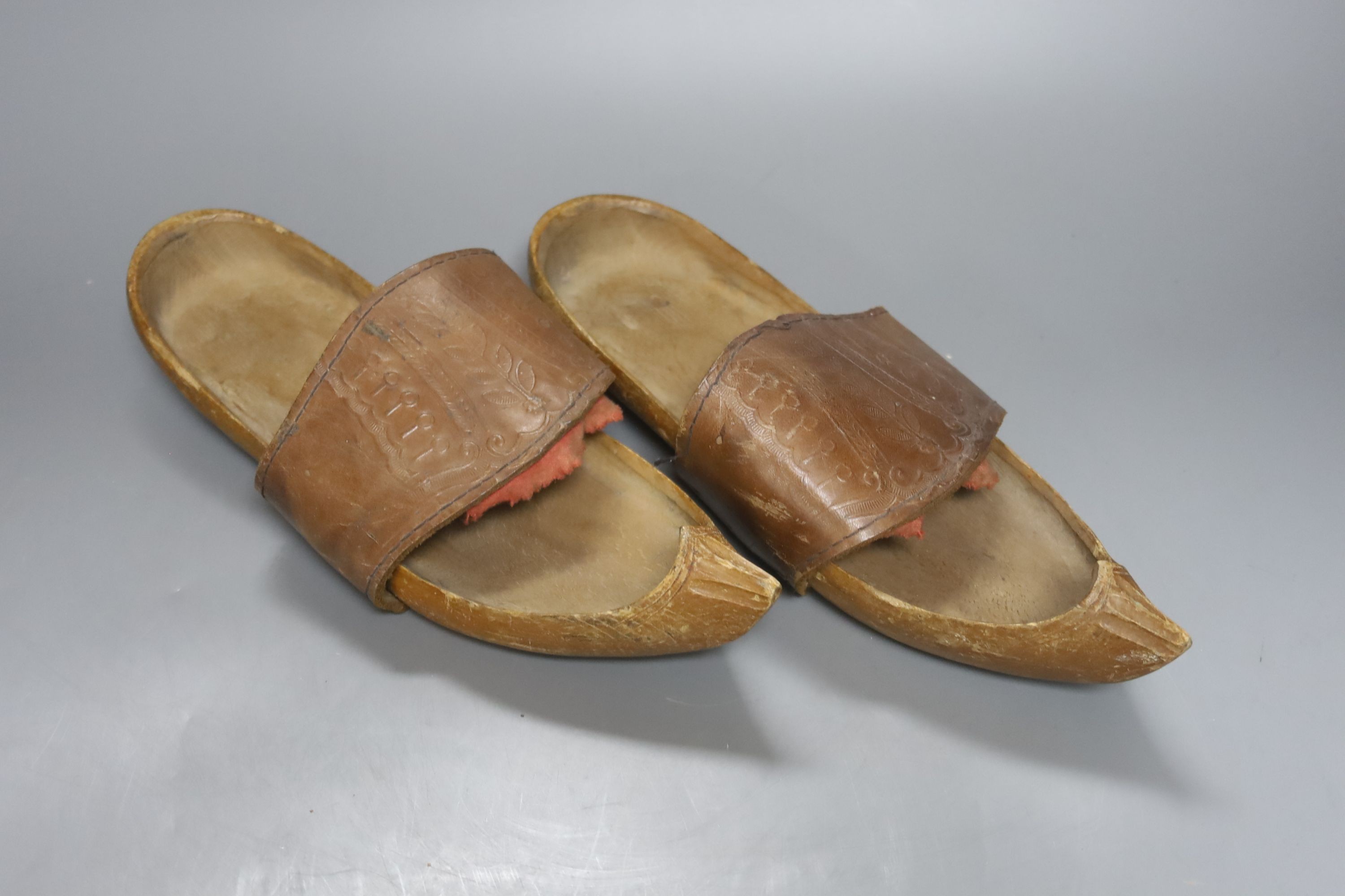 A pair of Eastern carved shoes 28cm